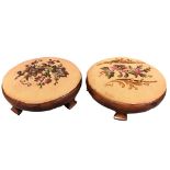 A pair of Victorian mahogany footstools with circular upholstered drop-in floral wool & beadwork