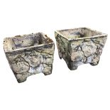 A pair of square composition stone tapering garden tubs naturalistically cast as rocks above