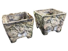 A pair of square composition stone tapering garden tubs naturalistically cast as rocks above