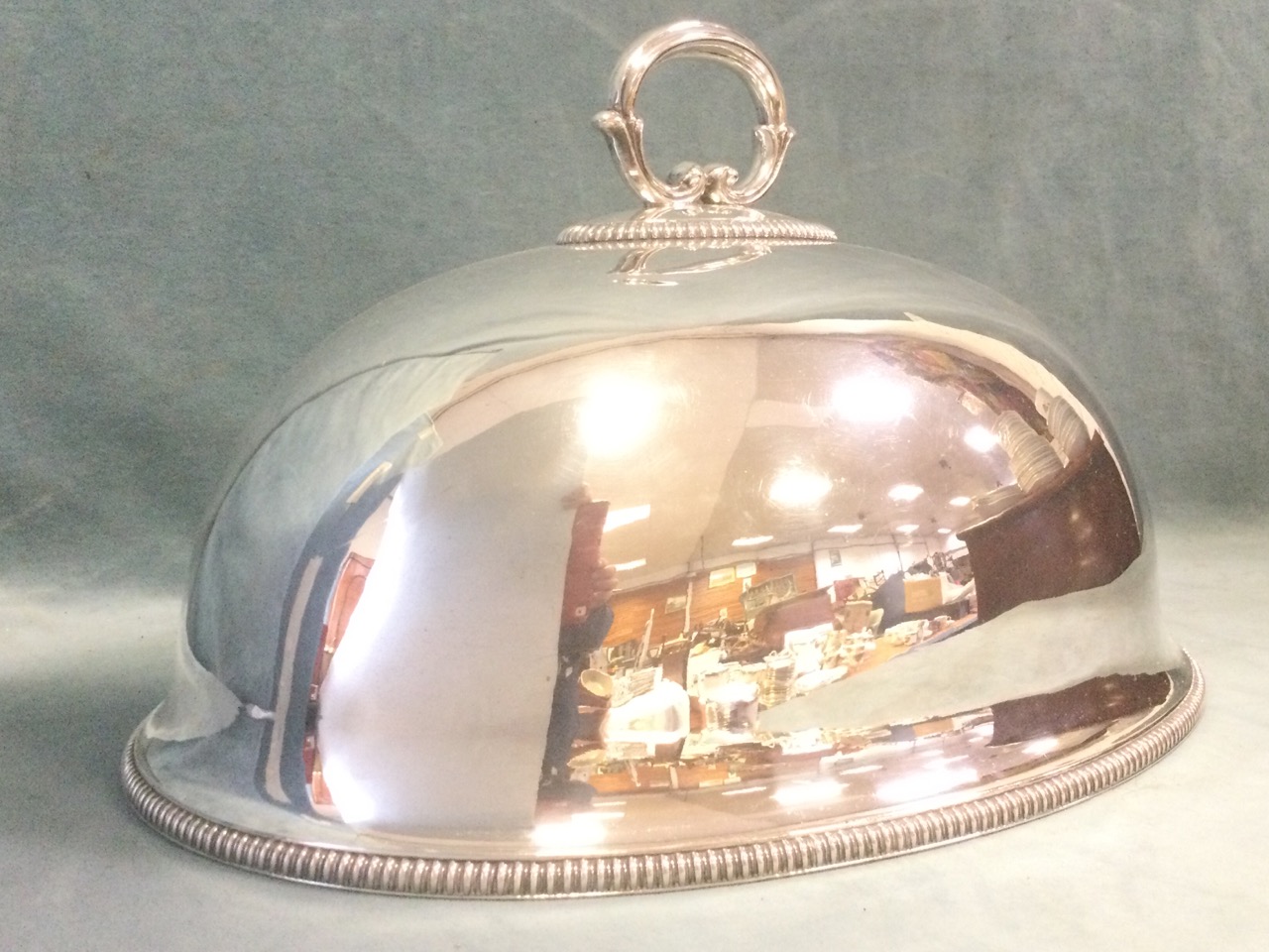 A late Victorian oval domed silver plated food cover with scrolled handle and beaded decoration. ( - Image 2 of 3