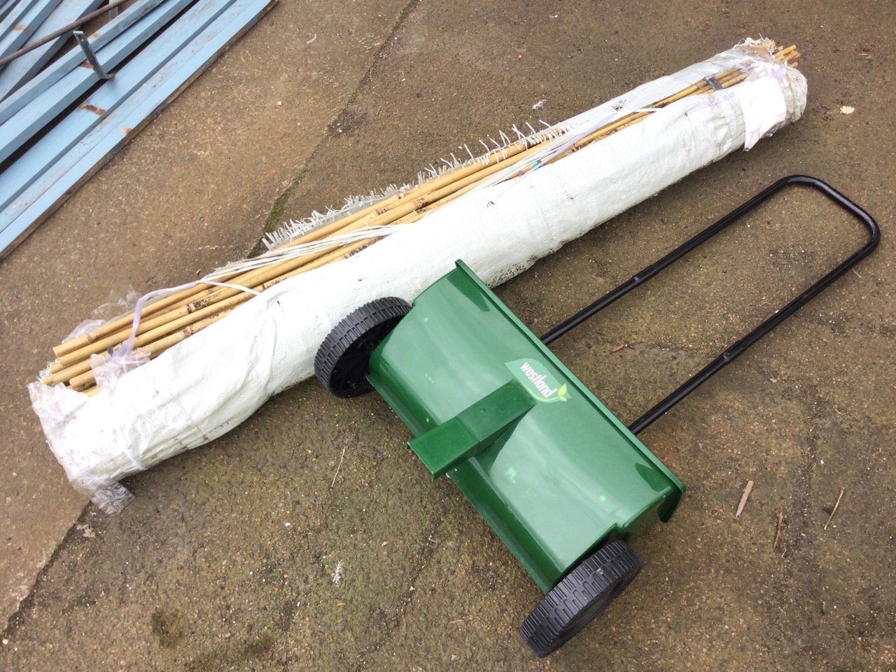 A quantity of 5ft bamboo garden poles; a Westland lawn fertiliser spreader; and an iron shell shaped - Image 2 of 3