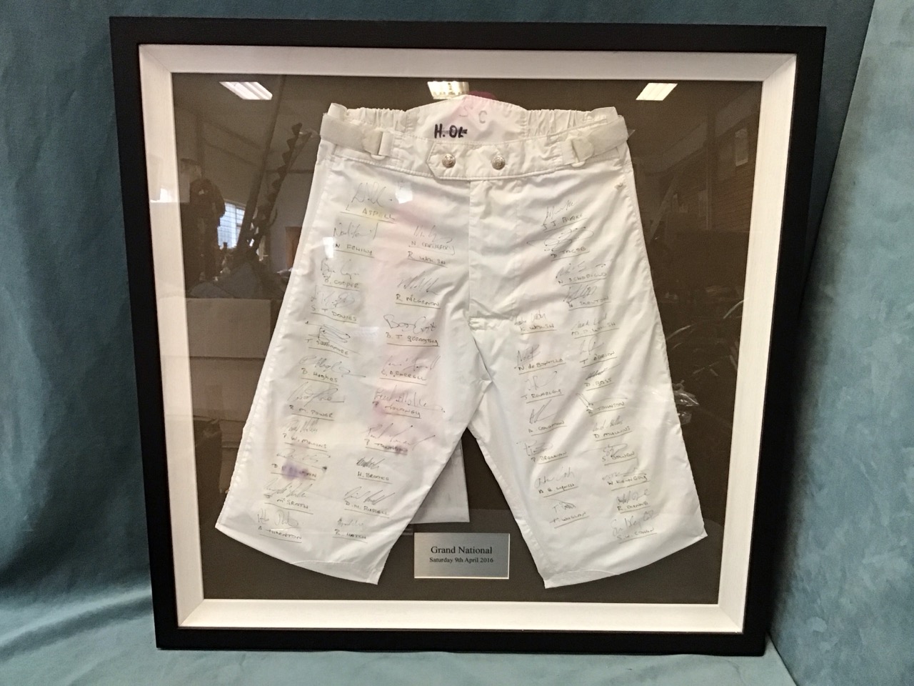 A pair of riding breeches worn by Sam Whaley Cohen in the 2016 Grand National, signed by the