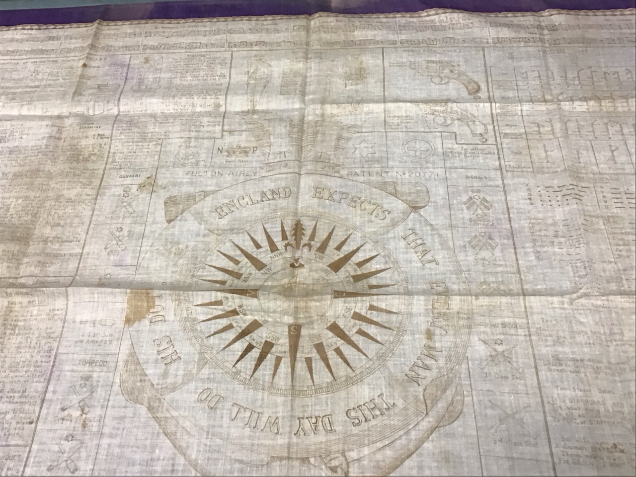 A Victorian printed cotton kerchief with a compass and Nelsons England Expects motto framed by naval - Image 2 of 3