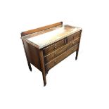 An Edwardian mahogany chest of drawers with raised back and moulded rectangular top with plate glass