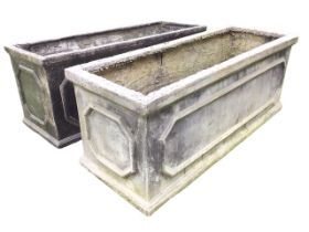 A pair of rectangular faux lead garden troughs with moulded plinths and rims, having panelled sides.