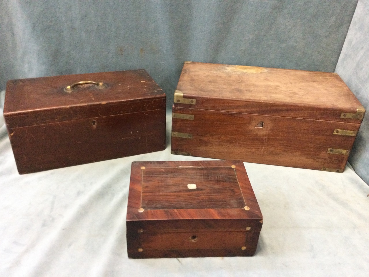 A Victorian mahogany writing box with brass mounts having drawer to side; a nineteenth century