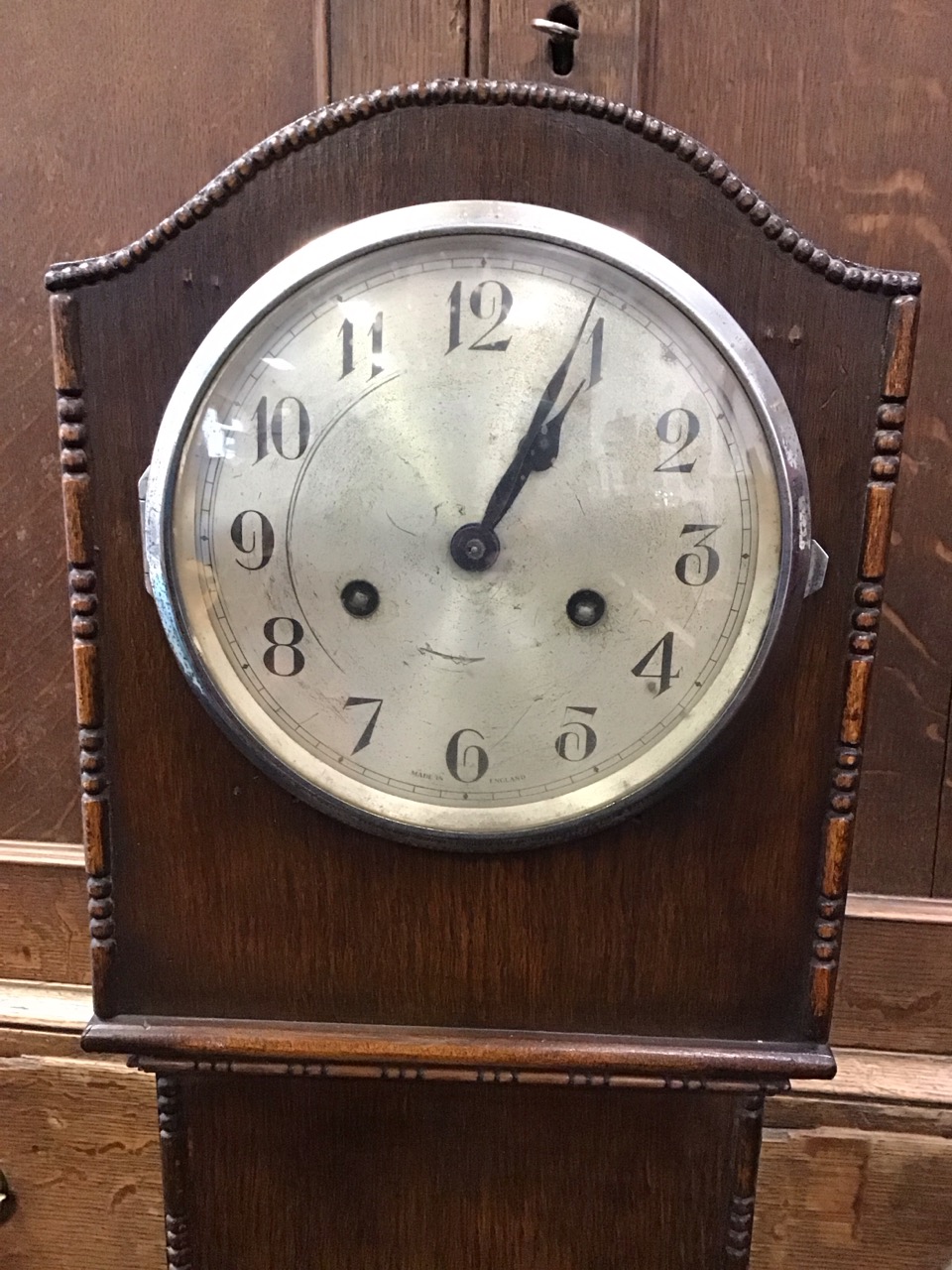 A 30s oak hood grandmother clock with reel & bead applied vorders, having arched above a circular - Image 2 of 3