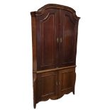 A C18th Dutch corner cabinet with shaped arched cornice above a pair of panelled doors with
