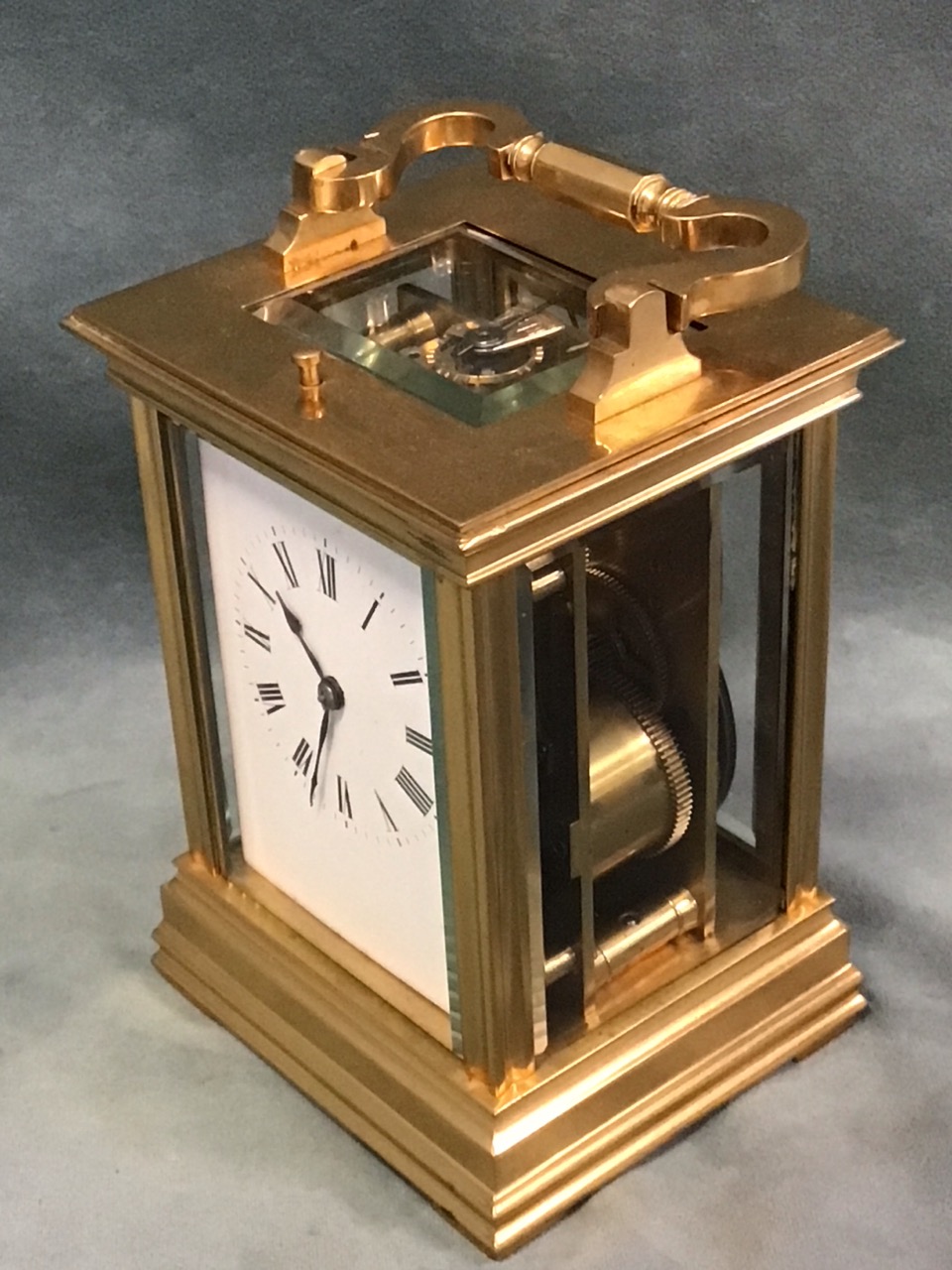 A gilt brass gorge cased repeating carriage clock, with bevelled glass panels and enamelled dial - Image 3 of 3