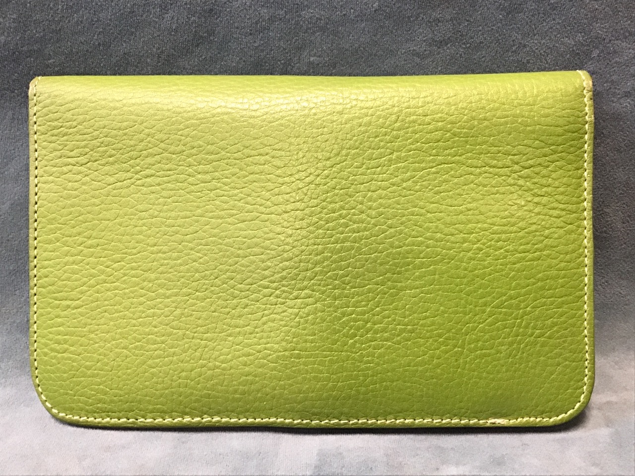 An olive green Hermès leather wallet, with dual compartments & card holders, having metal and - Image 3 of 3