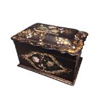 A Victorian rectangular papier-mâché tea caddy with moulded wavy edged cover twin lined