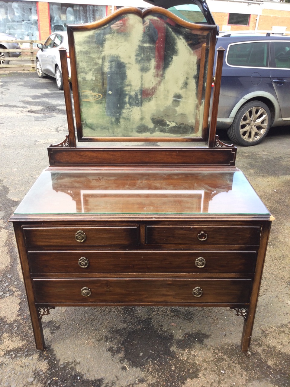 A stained mahogany dressing table with carved pierced spandrels, the scalloped framed bevelled - Image 2 of 3