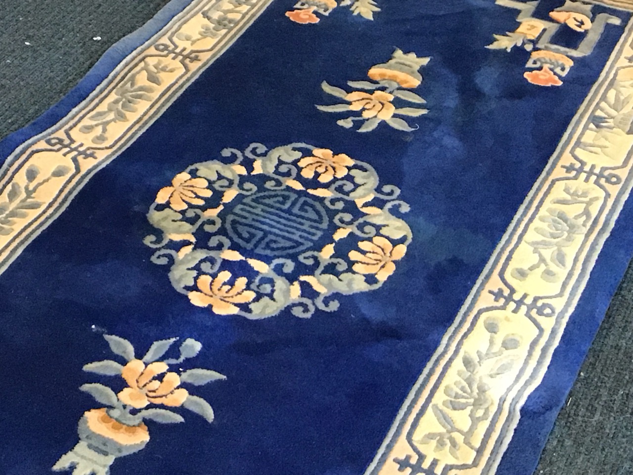 A Chinese wool carpet with central floral Shou medallion on a blue field with plantpots, braziers - Image 2 of 3