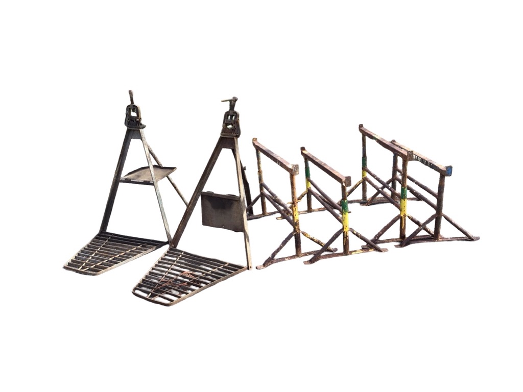 Two pairs of builders adjustable trestles on tubular supports with angled legs; and a pair of