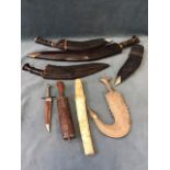 Three Gurkha kukris with leather scabbards & another scabbard; a Japanese o tanto sword with