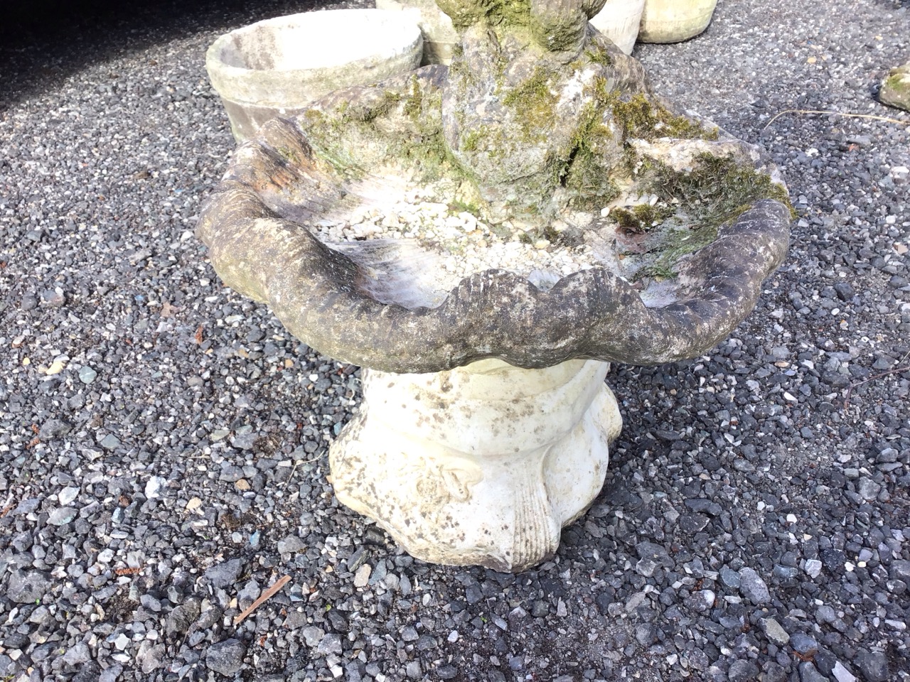 A composition stone garden birdbath cast as a shell with panpipe boy to rim, the square moulded - Image 2 of 3