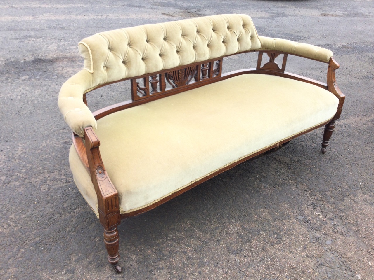 A Victorian walnut sofa with button upholstered back and rounded arms on carved pierced splats, - Image 3 of 3
