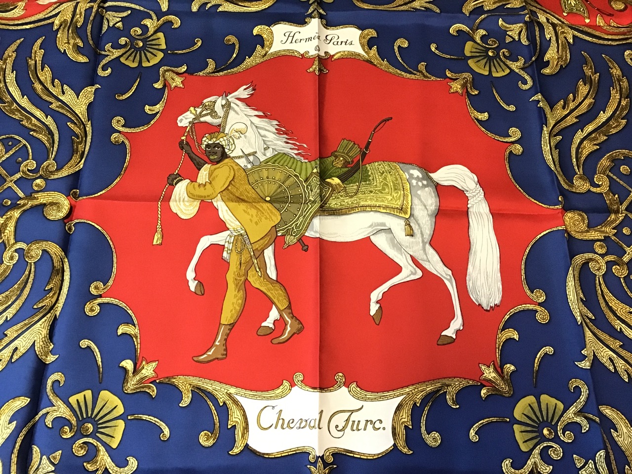 A Hermès silk scarf titled Cheval Turc, with central panel depicting a white horse & attendant, - Image 2 of 3