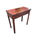 A George III mahogany turn-over-top tea table, the twin leaves opening on a swing leg, above a