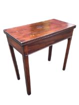 A George III mahogany turn-over-top tea table, the twin leaves opening on a swing leg, above a