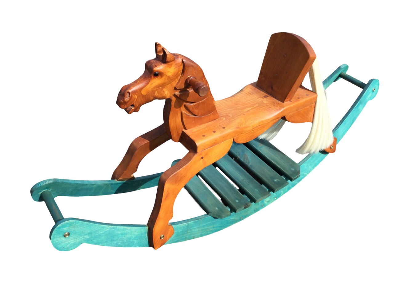A contemporary pine rocking horse with carved head, glass eyes. horsehair tail and painted curved