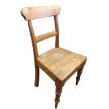 A Victorian elm and ash chair with shaped back and plain rail above a solid seat, raised on turned