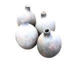 Four ovoid mis-shaped handmade pots with tubular apertures. (14in) (4)