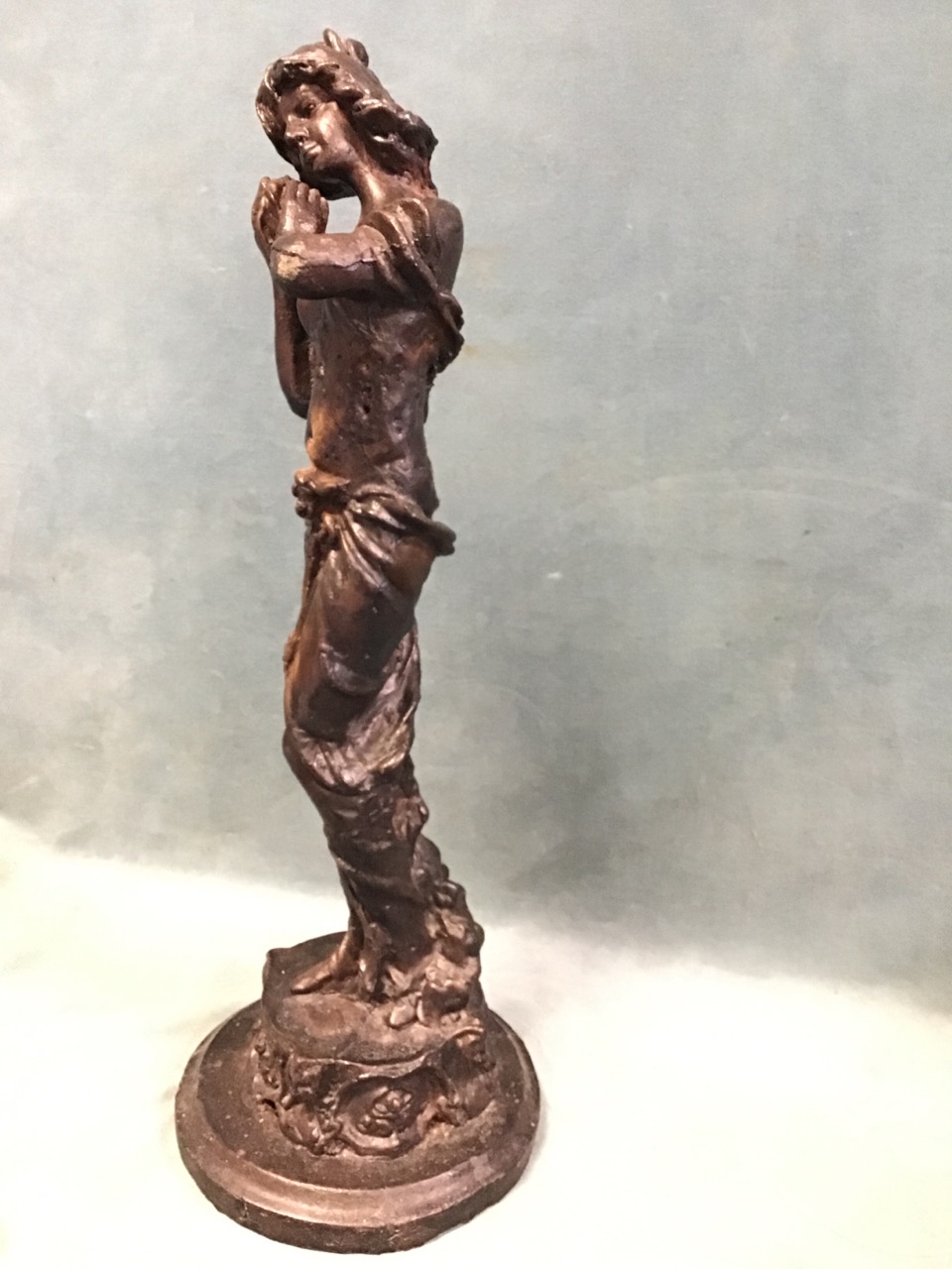 A cast iron figure with bronze patination depicting a classically draped lady listening a - Image 3 of 3