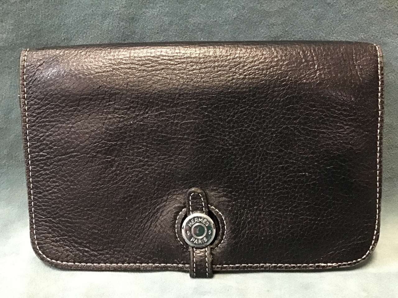 A black leather Hermès wallet, with removable coin purse, twin compartments and contrasting