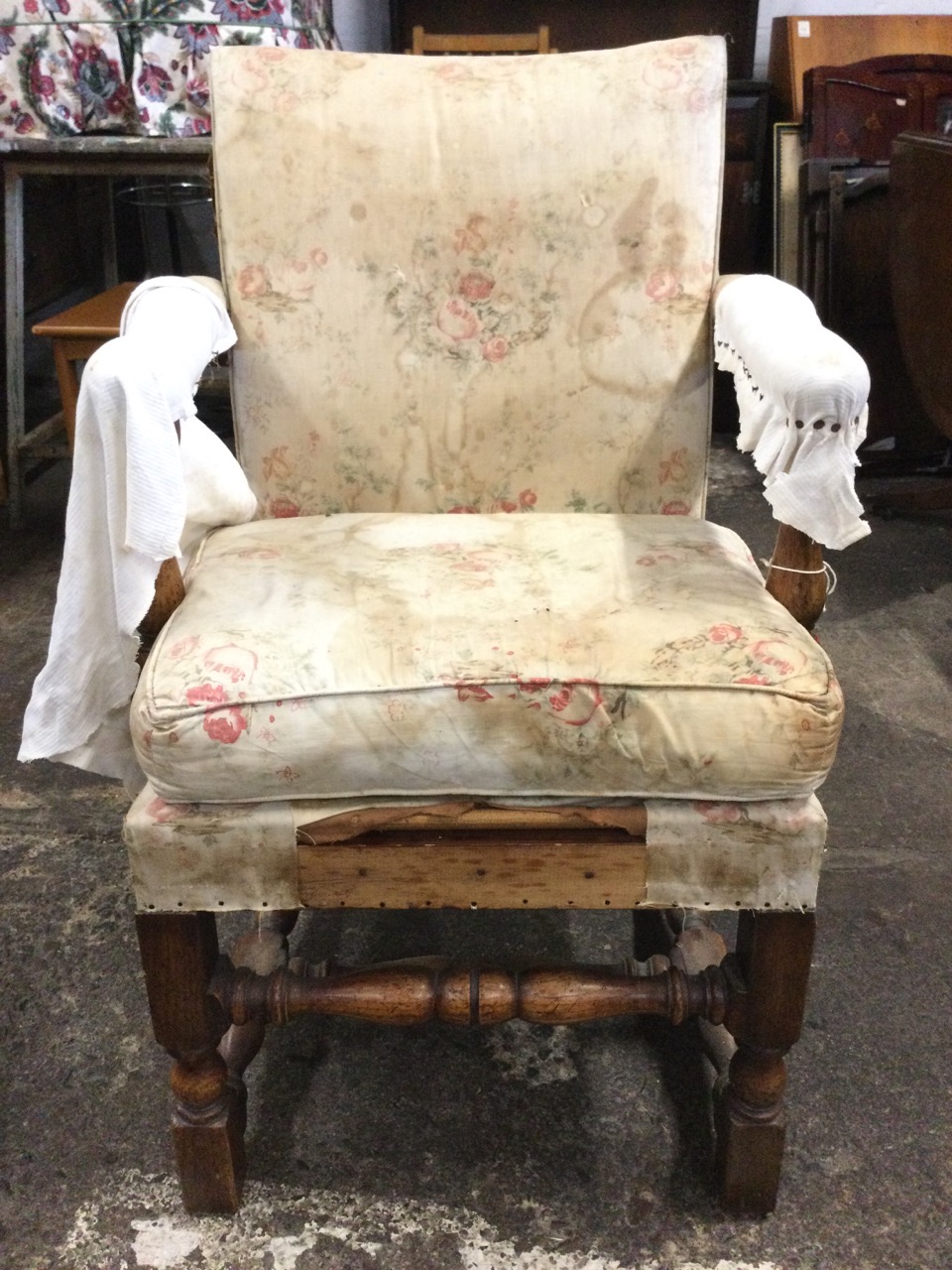 An Edwardian oak carolean style upholstered armchair, the seat with loose cushion flanked by - Image 2 of 3