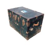 A rectangular American cabin trunk with metal covering and iron studded mounts, with Orient &