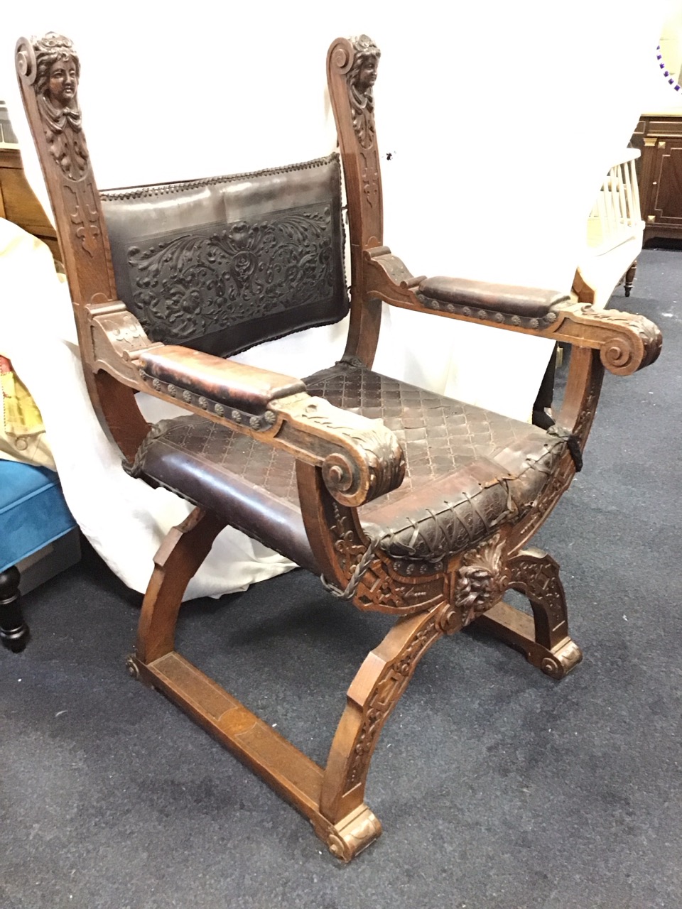 A C19th Renaissance style oak armchair with foliate stamped leather upholstered backrest on scrolled - Image 3 of 3
