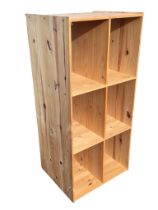 A pine shelf unit with six deep compartments. (22.75in x 19in x 49.75in)