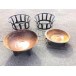 A firepit type bowl with rolled rim and twin handles on four shaped legs; another similar bowl/basin