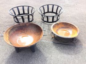 A firepit type bowl with rolled rim and twin handles on four shaped legs; another similar bowl/basin