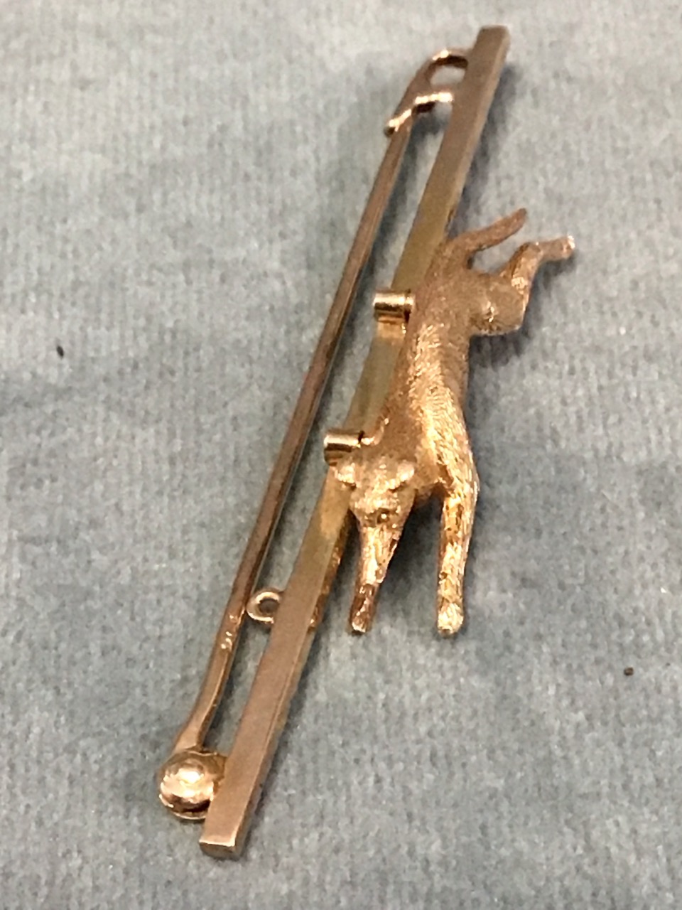 A 9ct gold stock pin with a finely modelled running greyhound. (2.25in) (5g) - Image 3 of 3