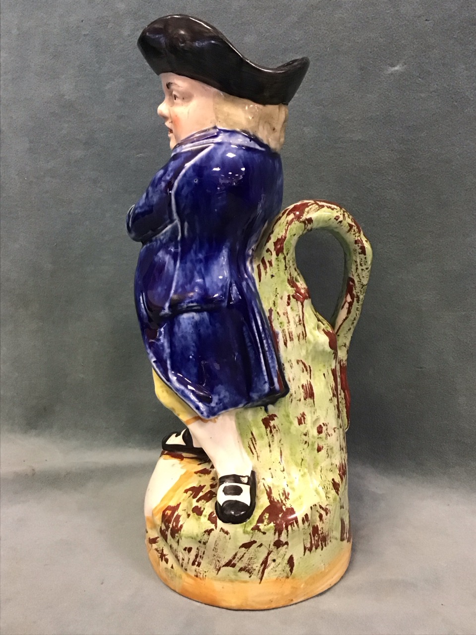 A C19th Staffordshire ceramic hearty goodfellow toby jug, the standing smiling figure holding a pipe - Image 2 of 3