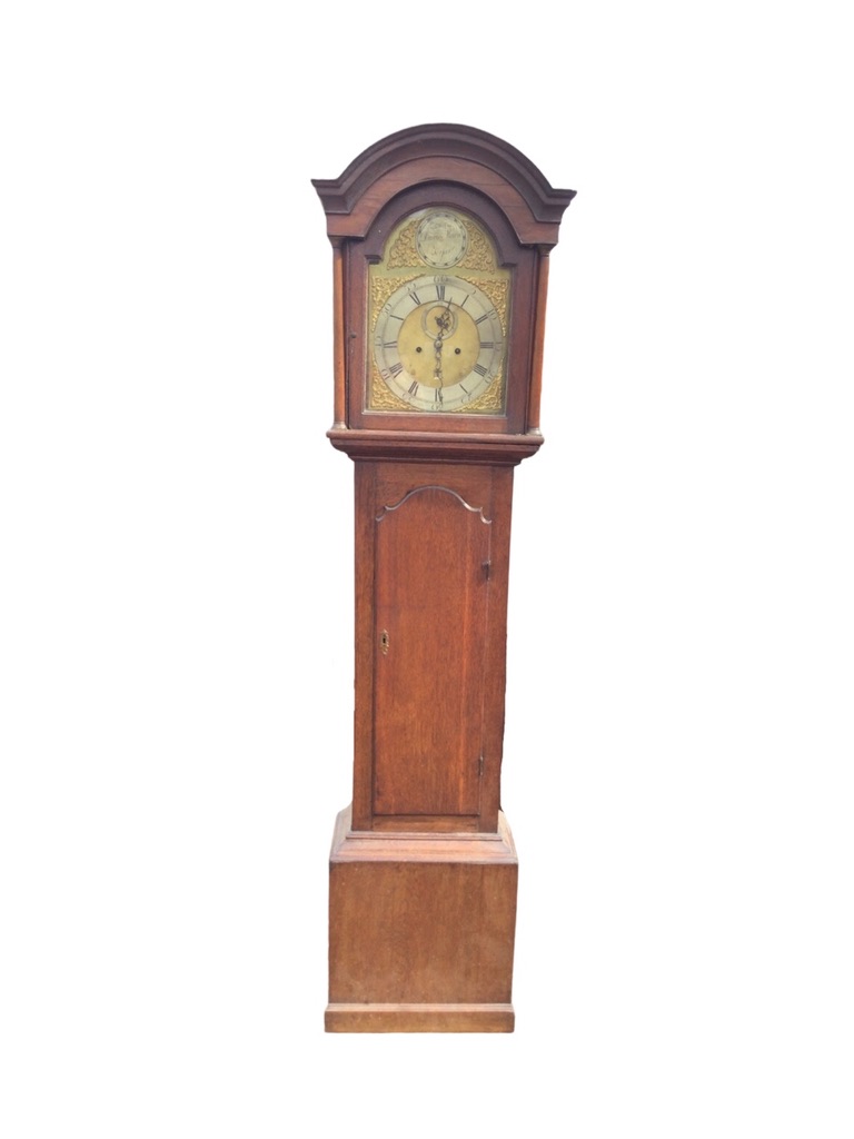 A Georgian oak longcase clock by David Mudie of Forfar, with arched cornice above a brass dial