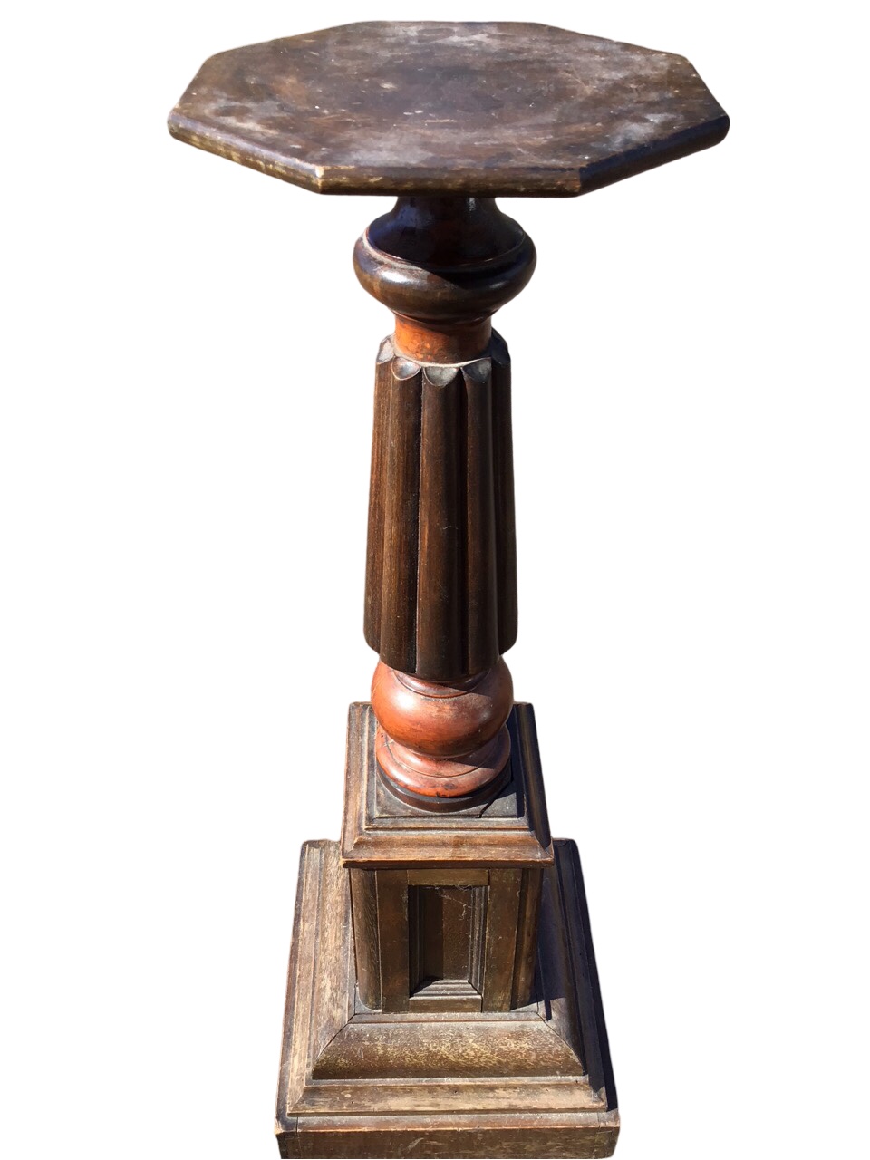 A Victorian jardiniere stand with octagonal platform on turned and fluted column above a panelled