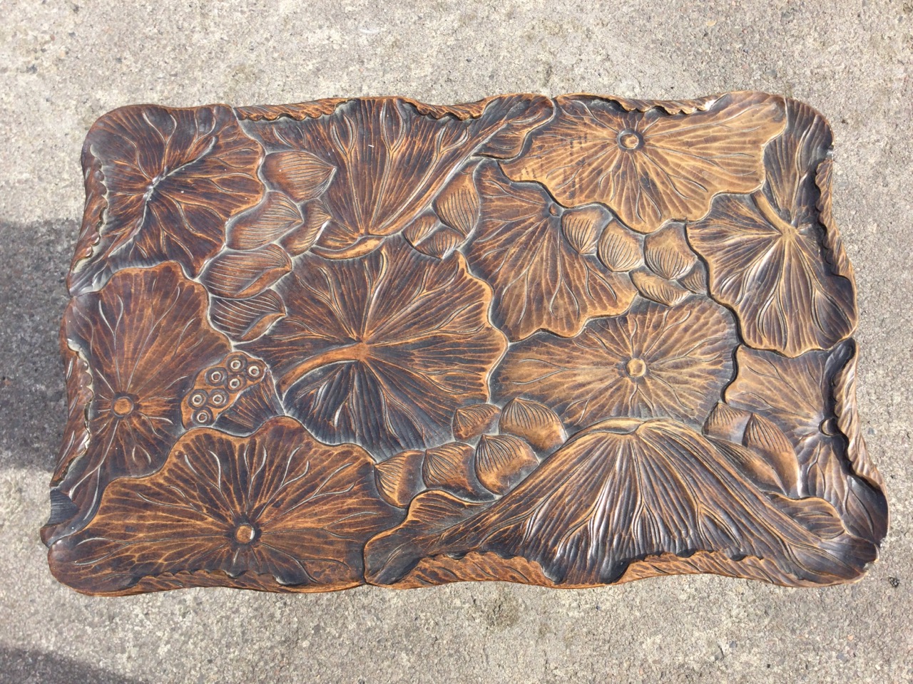 An early C20th Japanese hardwood occasional table with shaped rectangular top carved with lotus pads - Image 2 of 3