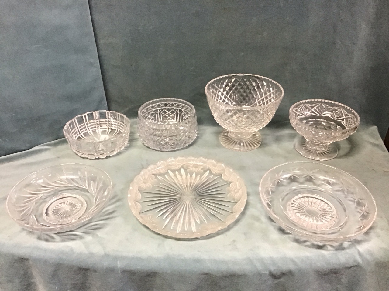 Miscellaneous cut glass bowls - two Stuart shallow footed, a Stuart pedestal punch bowl, a Harbridge