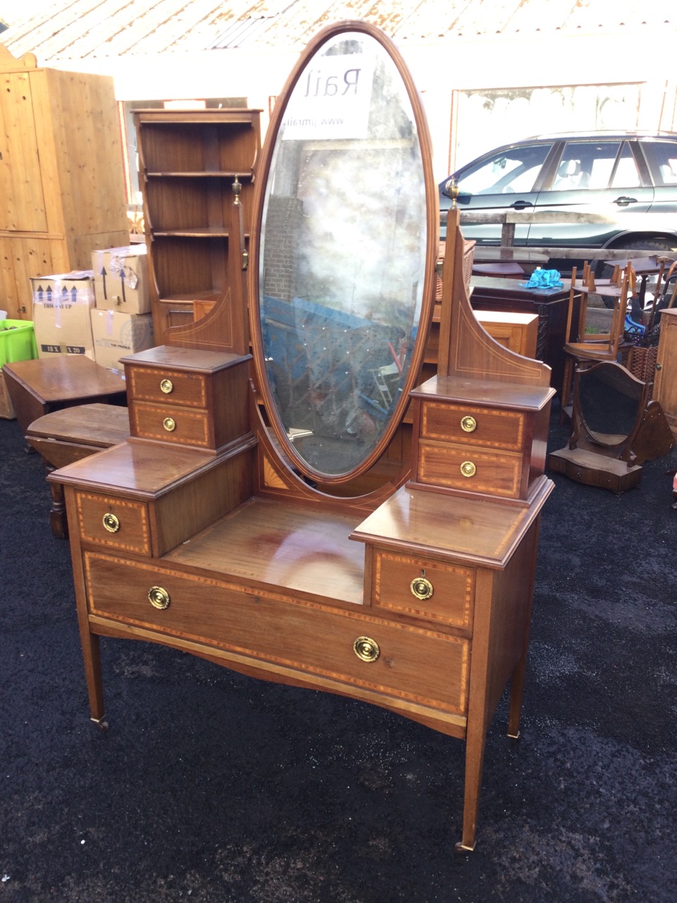 A Victorian mahogany satinwood banded dressing table, with oval bevelled mirror on columns with - Image 2 of 3