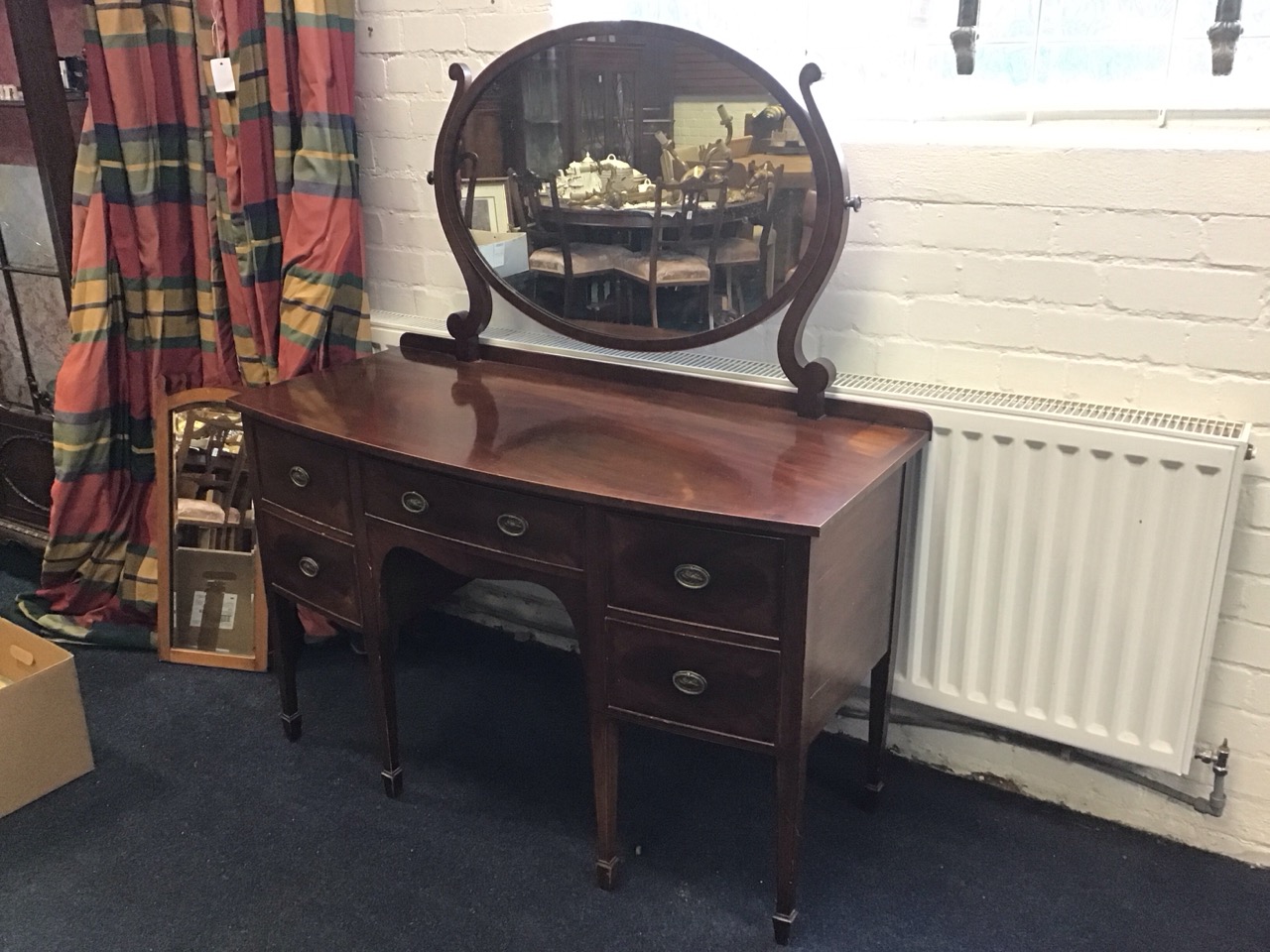 A bowfronted late Victorian mahogany dressing table with oval mirror on shaped supports above a - Image 2 of 3