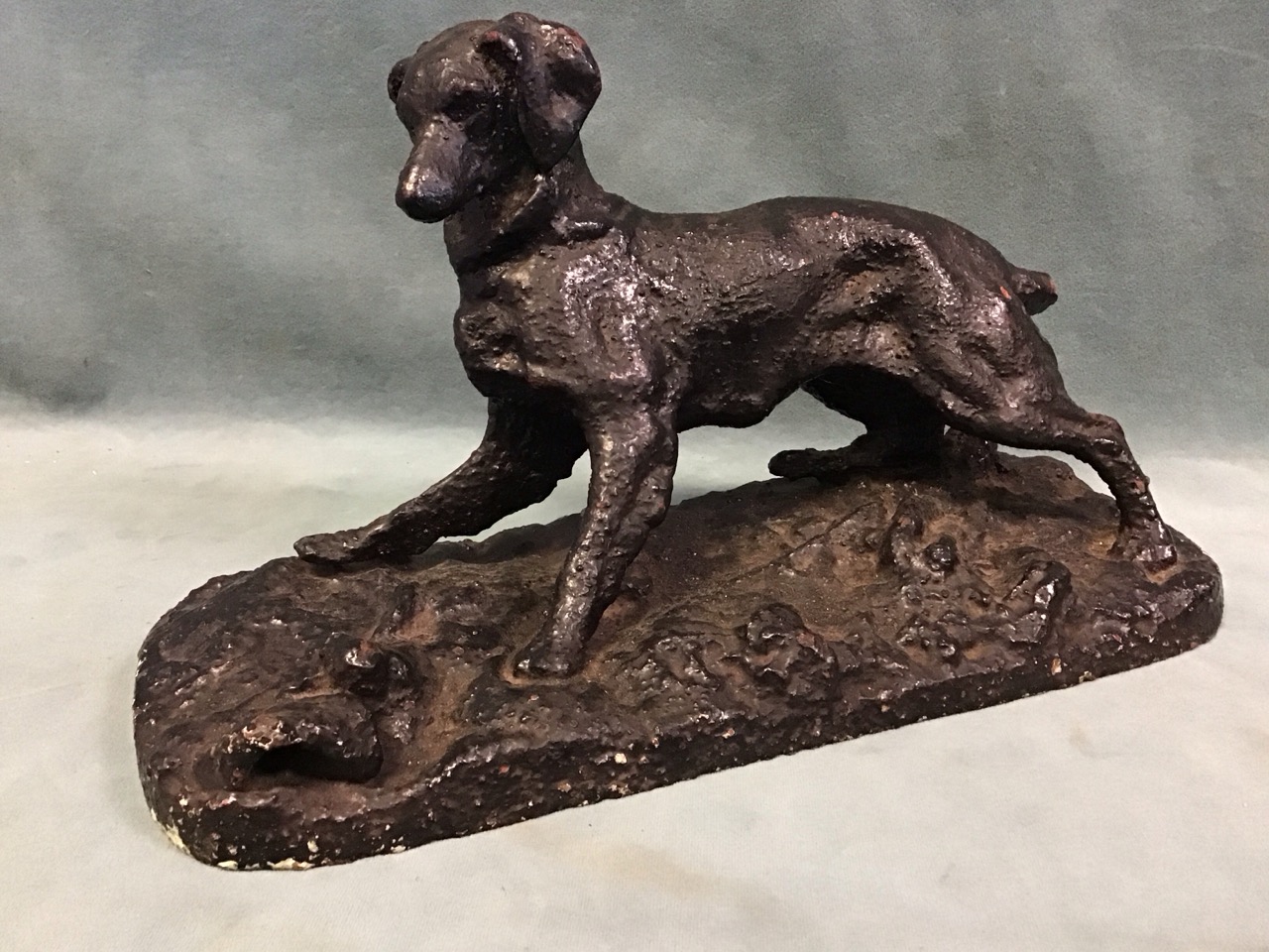 A C19th cast iron figure of a startled spaniel with a dark patina, after Pierre Jules Mêne. (6.5in)
