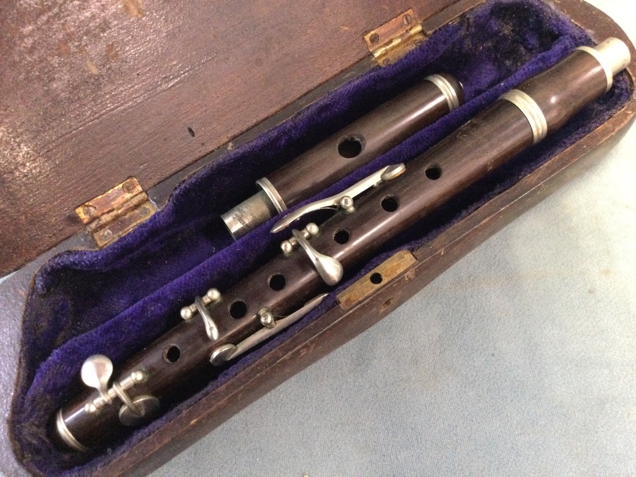 A cased Hawks & Son rosewood piccolo; another similar rosewood instrument by Hawkes; and a third - Image 2 of 3