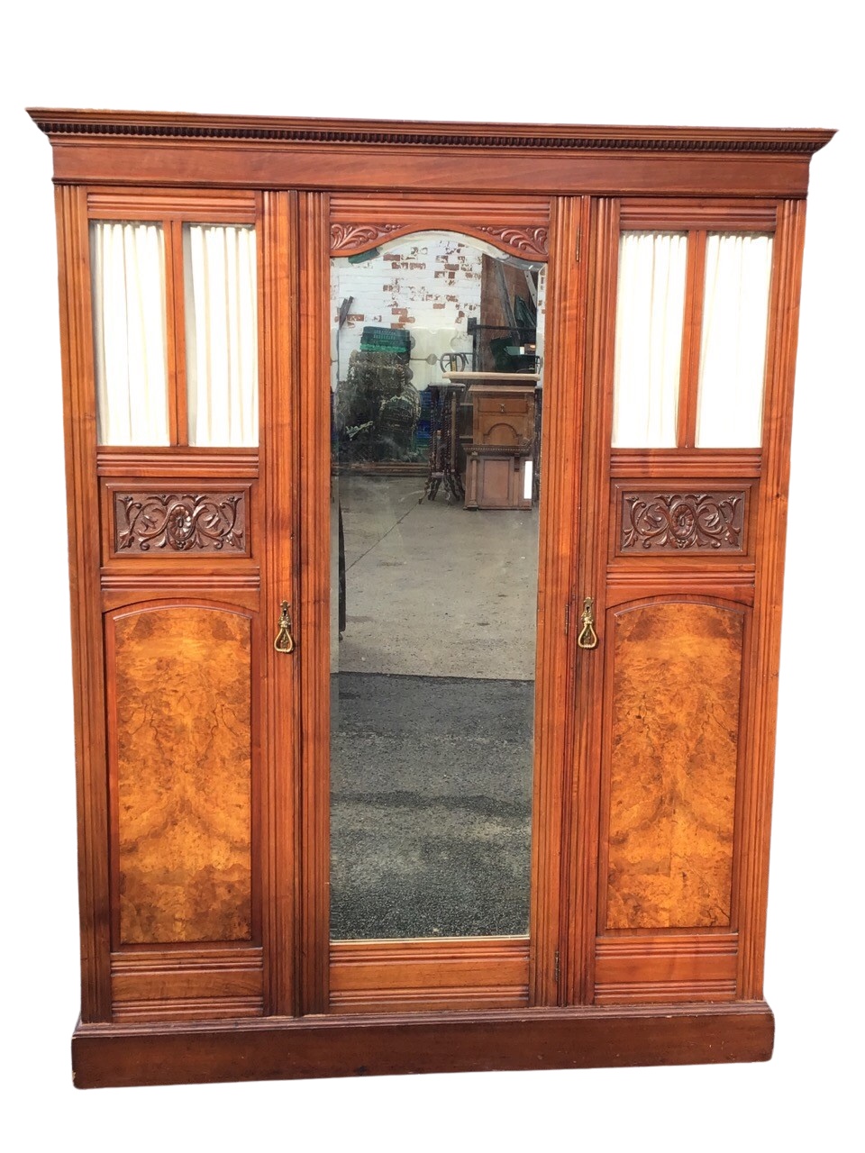 A Victorian mahogany wardrobe with moulded cornice above a central arched mirror door with foliate - Image 2 of 3