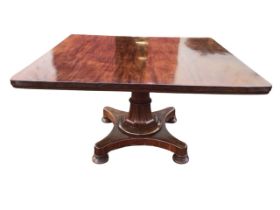 A William IV mahogany breakfast table, the rectangular top tilting on a tapering flared octagonal