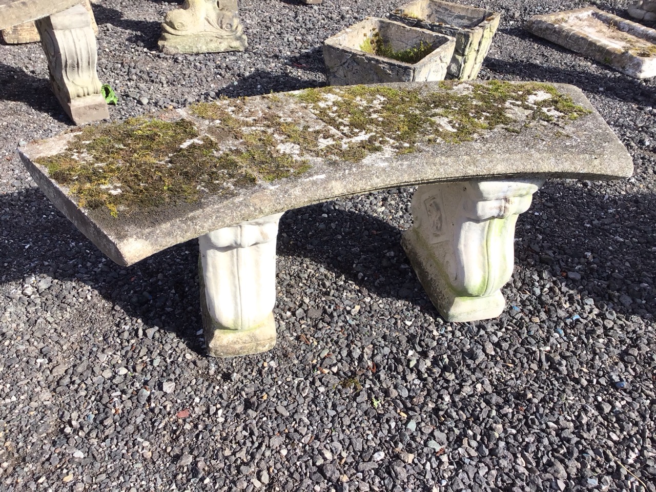 A composition stone crescent shaped garden bench with moulded slab seat on twin scrolled supports - Image 3 of 3