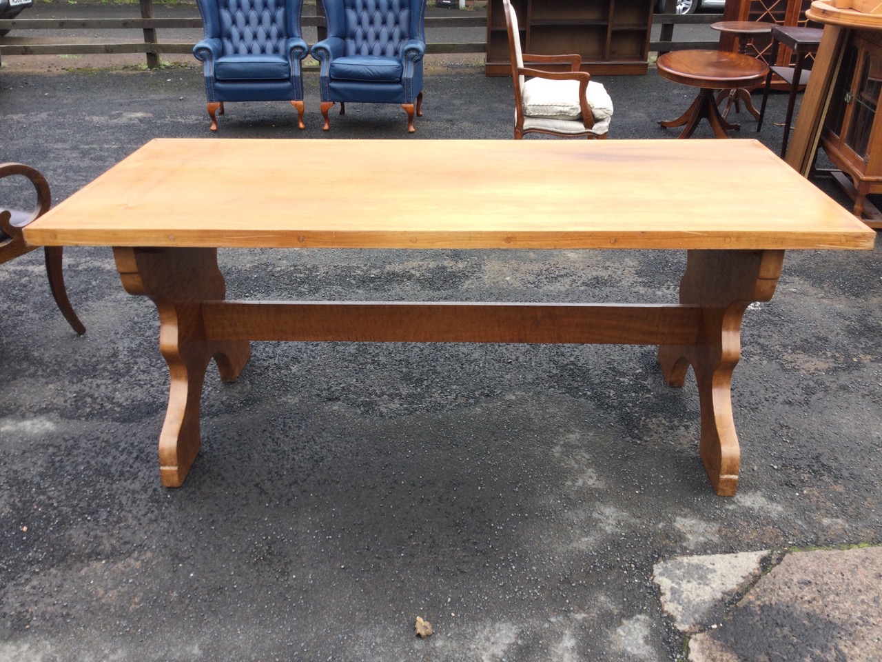 A contemporary mahogany refectory table with rectangular panelled top on shaped trestle supports - Image 2 of 3
