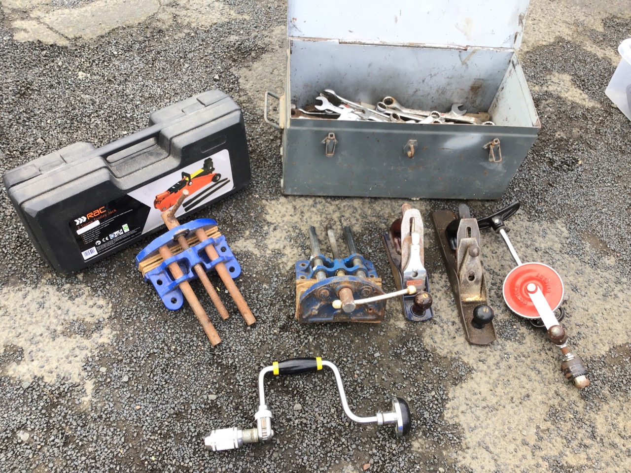 Two Record cast iron bench vices; a large collection of spannersin tin box; and miscellaneous